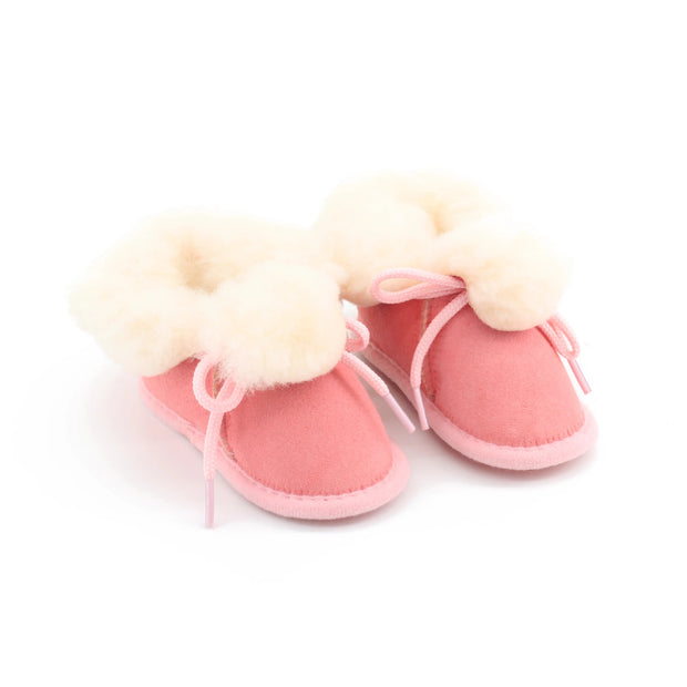 Chaussons bébé rose en peau de mouton